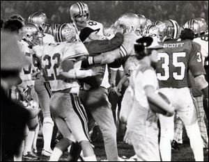 Ohio State coach Woody Hayes is restrained by offensive guard Ken Fritz after he struck Clemson’s Charlie Bauman in the Gator Bowl in Jacksonville on Dec. 29, 1978. Hayes was fired after going 205-61-10 in 28 seasons at Ohio State.