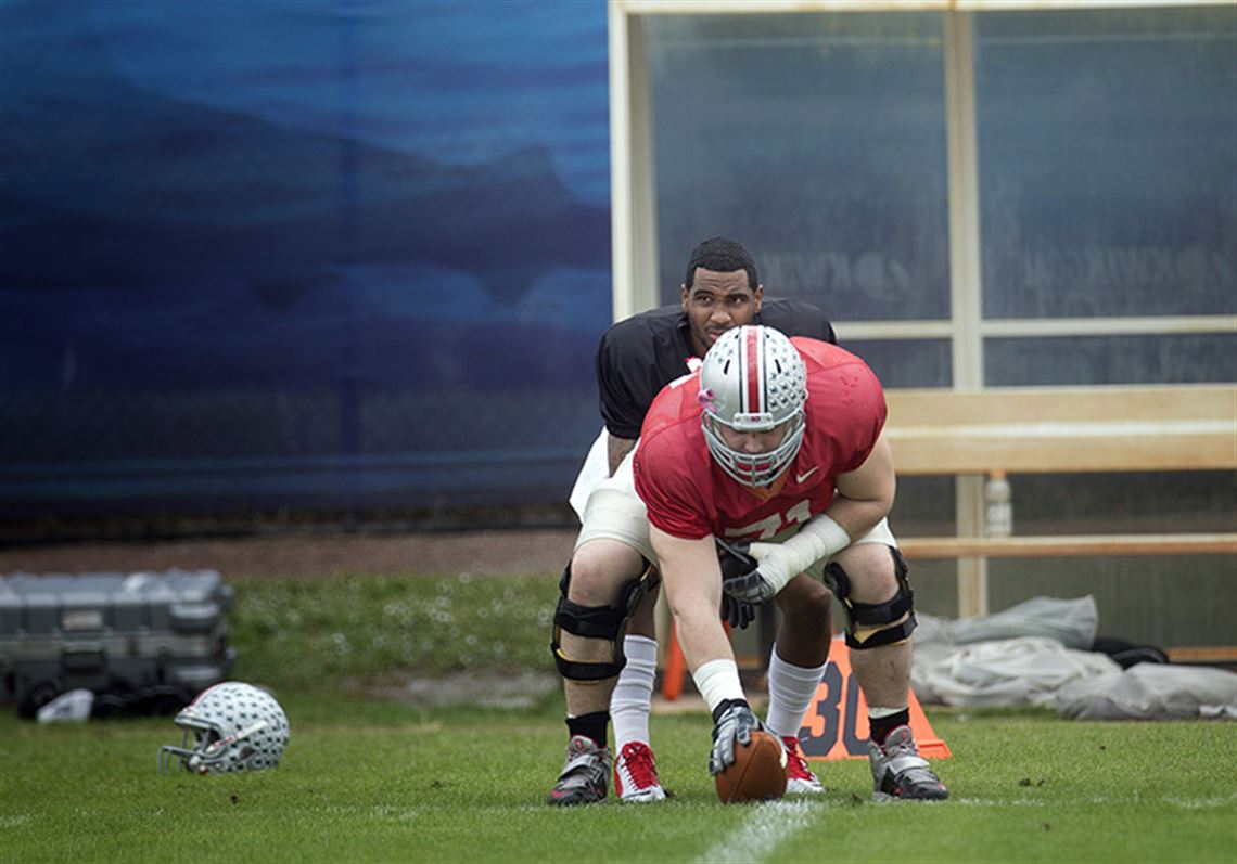 Quarterback Braxton Miller takes snaps from center Corey Linsley as the Buckeyes get ready to play Clemson in the Orange Bowl.