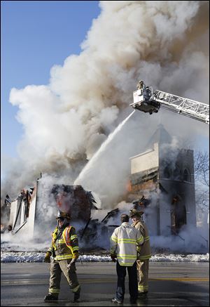 Toledo firefighters battle a fire at St. Mark Baptist Church on North Detroit Avenue, which gutted the 111-year-old church. SEE STORY, PHOTO, PAGE B1.