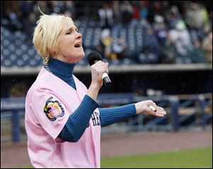 WTOL-TV,  Channel 11 news anchor  Chrys Peterson sings the national anthem prior to the start of the Mud Hens’ home-opener April 11 at Fifth Third Field.