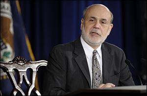 Federal Reserve chief Ben Bernanke announced the move as the U.S. economy gained steam.
