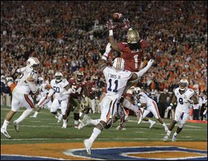 Florida State's Kelvin Benjamin catches the game-winning touchdown pass.