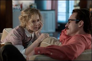 Amy Adams, left, and Joaquin Phoenix in a scene from 