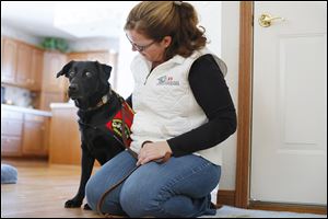 Tracy Spader of Lambertville adopted Jig, a Labrador retriever who was an explosives detection dog with the Marines. Jig served in Afghanistan from 2008 to 2011 until he was diagnosed with oral melanoma. He is now in remission.