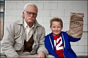 Johnny Knoxville as Irving Zisman and Jackson Nicoll as Billy in ‘Jackass Presents: Bad Grandpa.’