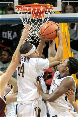 Toledo forward J.D. Weatherspoon, left, pulls down a defensive rebound against Central Michigan next to Justin Drummond. Weatherspoon had 14 points and a career-high 11 rebounds.