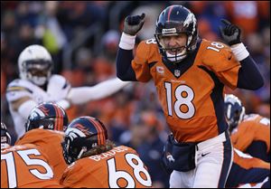 Broncos quarterback Peyton Manning calls an audible at the line of scrimmage against the San Diego Chargers on Sunday in Denver.