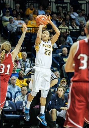 UT’s Inma Zanoguera shoots over the hand of Miami’s Haley Robertson in the second half. Zanoguera scored 18 points.