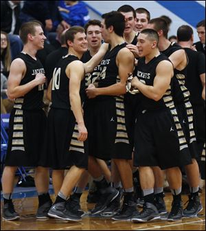 Perrysburg celebrates their victory against Anthony Wayne during basketball game at Anthony Wayne High School in Whitehouse, Ohio, today.