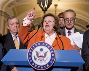 Senate Appropriations Committee Chair  Sen. Barbara Mikulski, D-Md., flanked by Senate Majority Whip Richard Durbin of Ill., left, and Sen. Charles Schumer, D-N.Y., speaking on Capitol Hill in Washington. 