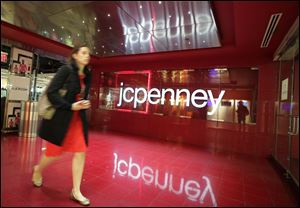 A customer leaves a J.C. Penney store in New York. 
