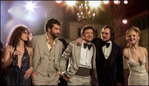 From left,  Amy Adams, Bradley Cooper, Jeremy Renner, Christian Bale and Jennifer Lawrence in 'American Hustle.'