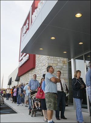 Customers lined up for the perks to be the first 100 patrons during the September grand opening of the Art Van Furniture store in Holland. It went up in what used to be a cin­ema com­plex.
