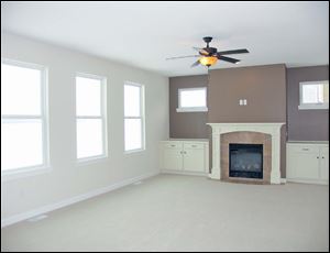 The family room fireplace is ready to serve as your family photo backdrop.
