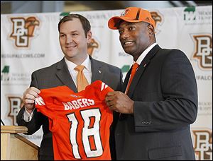 Dino Babers, right, is named the new BG football coach by athletic director Chris Kingston on Dec. 19. Babers said every player will be entering spring competition vying for a starting position.