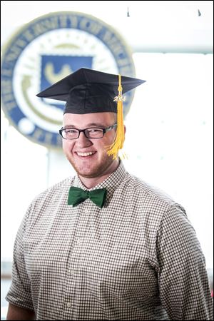 Alex Benda, 22, says he hopes to sell ad space on his graduation cap to take a bite out of his education debt.  