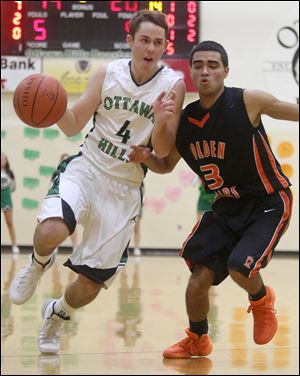 Ben Silverman drives past Gibsonburg's Isaih Arriaga. Silverman, a 5-foot-11 point guard, averages 7.3 points and 3.9 assists. He has made 20 of 21 free throws this season.  The senior has signed to play golf at Duke. Ottawa Hills finished 22-5 last year after losing in the Division IV regional final.