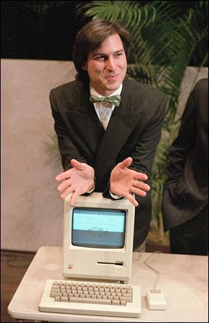 On Jan. 24, 1984, Steve Jobs, chairman of the board of Apple Computer, leans on the new ‘Macintosh’ in Cupertino, Calif. Early Macs showed a happy face when they started up.