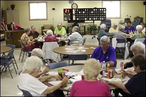 Dozens play bingo at the Oregon Senior Center. Programs helping seniors understand benefits, manage health problems, and get more exercise are under consideration with new levy funds.