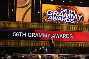 Host LL Cool J speaks on stage at the 56th annual Grammy Awards on Sunday at Staples Center in Los Angeles.