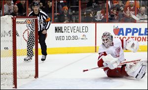 Detroit Red Wings goalie Jonas Gustavsson looks back at the goal scored by Philadelphia Flyers's Adam Hall in the second period.