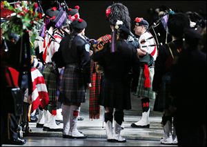 Bagpipers, who played a central role throughout the service for Stephen Machcinski and James Dickman, perform. STORY, PHOTOS ON PAGE A6.