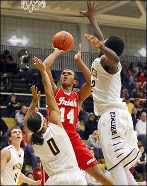 Whitmer’s Christopher Boykin, center, and Jonathon Ashe, right, defend Central’s DeShone Kizer, who finished with 10 points.
