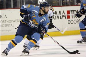 Toledo's Aaron Bogosiar (16) brings the puck around.