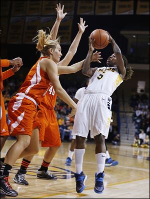 Toledo's Janelle Reed-Lewis, right, shoots over Bowling Green's Deborah Hoekstra, left, and Jill Stein. Reed-Lewis scored eight points in the loss for the Rockets on Sunday.