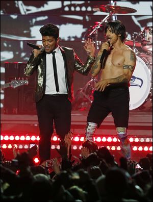 Bruno Mars, left, and the Red Hot Chili Peppers' Anthony Kiedis perform during the halftime show of Super Bowl XLVIII Sunday in East Rutherford, N.J.