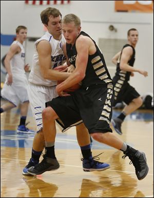 Perrysburg’s Matt Kaczinski, right, battles Anthony Wayne’s Hunter Johnson. Kaczinski, a senior, averages 9.2 points and 4.9 rebounds.