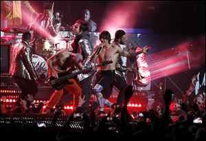 The Red Hot Chili Peppers perform during the halftime show of the NFL Super Bowl XLVIII football game between the Seattle Seahawks and the Denver Broncos.