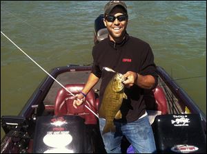 Seth Borton, 31, who has a sport and business management degree from Siena Heights, was recently named head coach of the new varsity bass fishing team at Adrian College.