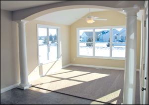 Enjoy this beautiful sunroom which opens to a lovely patio.