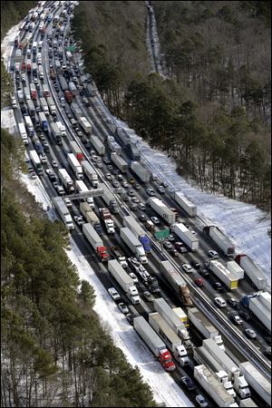 Traffic is snarled along the Interstate 285 perimeter, north of the metro area after a winter snowstorm, in Atlanta on Jan. 29.