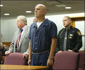 Ray Abou-Arab stands in before Lucas County Common Pleas Judge Frederick McDonald during his arraignment today.