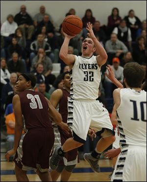 Lake's Connor Bowen shoots over Rossford's Brian Burks during 2nd half.