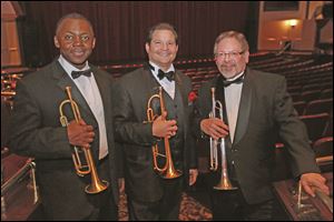 Trumpeters Dwight Adams, left, Patrick Hession, center, and Mike Williams.