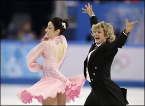 Meryl Davis and Charlie White of the United States compete in the ice dance short dance Sunday at the Iceberg Skating Palace in Sochi, Russia.