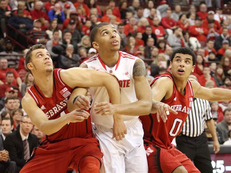 Ohio-State-s-Marc-Loving-center-is-squeezed-in-by-Nebraska
