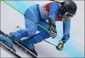 Slovenia's Tina Maze makes a turn in the second run of the women's giant slalom to win the gold medal today.