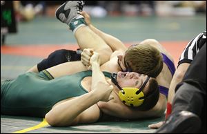 Clay’s Matt Stencel is in serious trouble as James Love of Reynoldsburg has him in a cradle in their Division I 182-pound match. Stencel came back and won by fall.