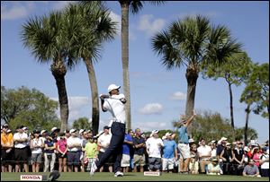 Tiger Woods hits on the 18th tee during the third round of the Honda Classic golf tournament Saturday in Palm Beach Gardens, Fla.
