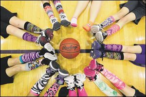 Colorful socks were a popular choice during the fifth grade Maumee Lady Panthers practice at the Maumee High School annex gym. 