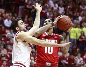 Indiana forward Will Sheehey, left, fouls Ohio State forward LaQuinton Ross on Sunday in Bloomington, Ind.