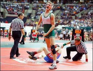 Delta’s Kyle Keller reacts after pinning Liberty-Benton’s Tyler Sarreshteh in the Division III 120-pound semifinal. Keller helped the Panthers win the team title.
