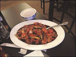 Mushroom chicken served with white rice.