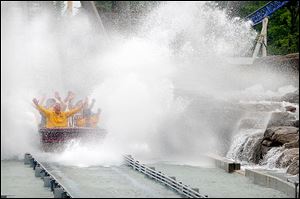 Cedar Point’s Shoot the Rapids, shown here in 2010. Last summer a chain pulling one of the boats came off the track, and the boat slipped back into the water. Seven people were injured.