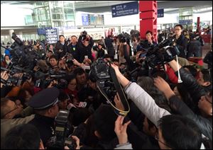 Reporters crowd at Terminal 3 of Beijing Capital International Airport, where the Malaysia Airlines Boeing 777-200 was to arrive today.
