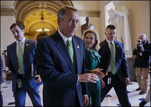 House Speaker John Boehner of Ohio leaves the House chamber on Capitol Hill in Washington, today.